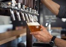 Beer pouring from tap